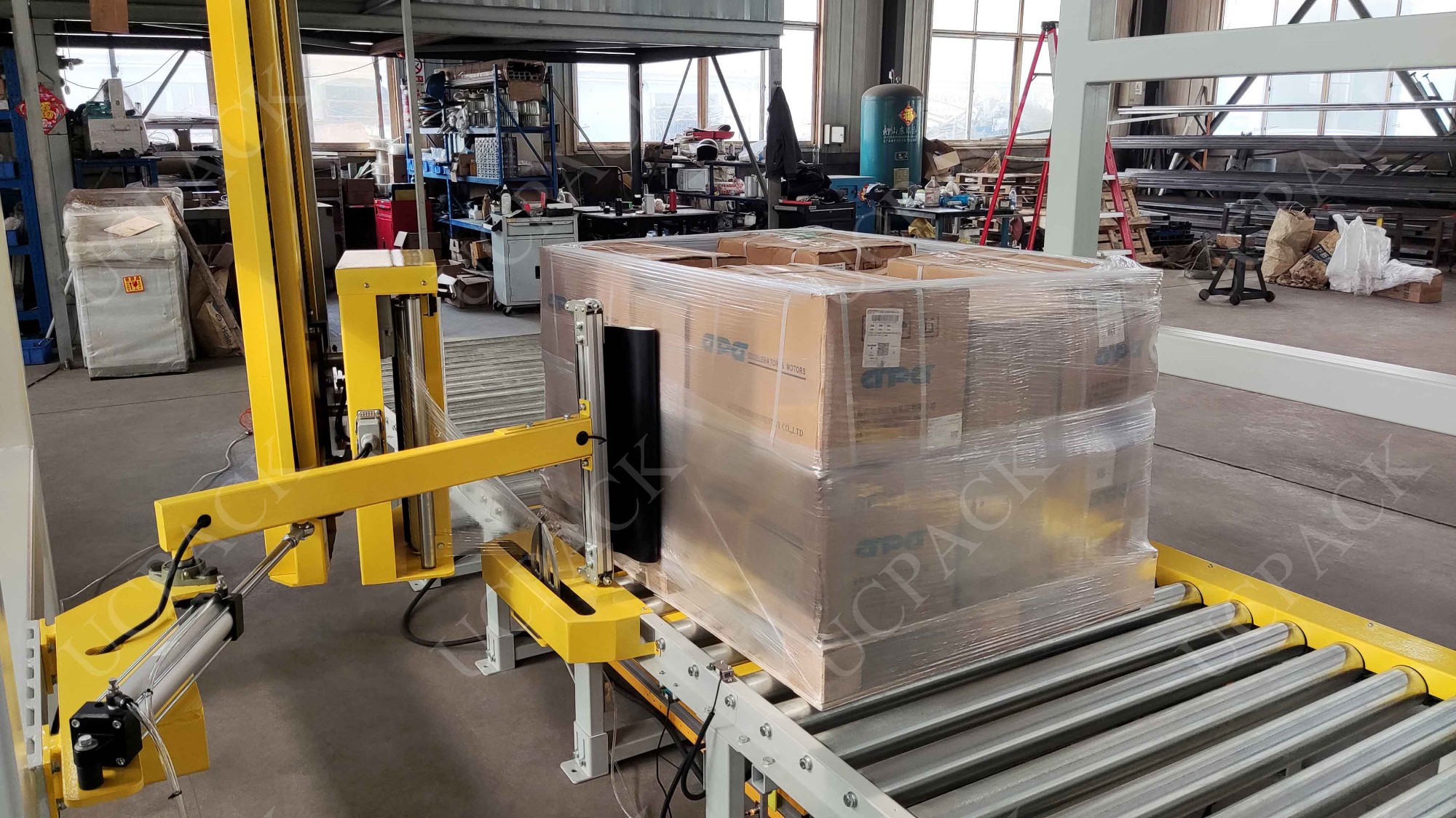 UCR-RP2000A Fully Automatic Inline Rotary Arm Pallet Stretch Wrapper