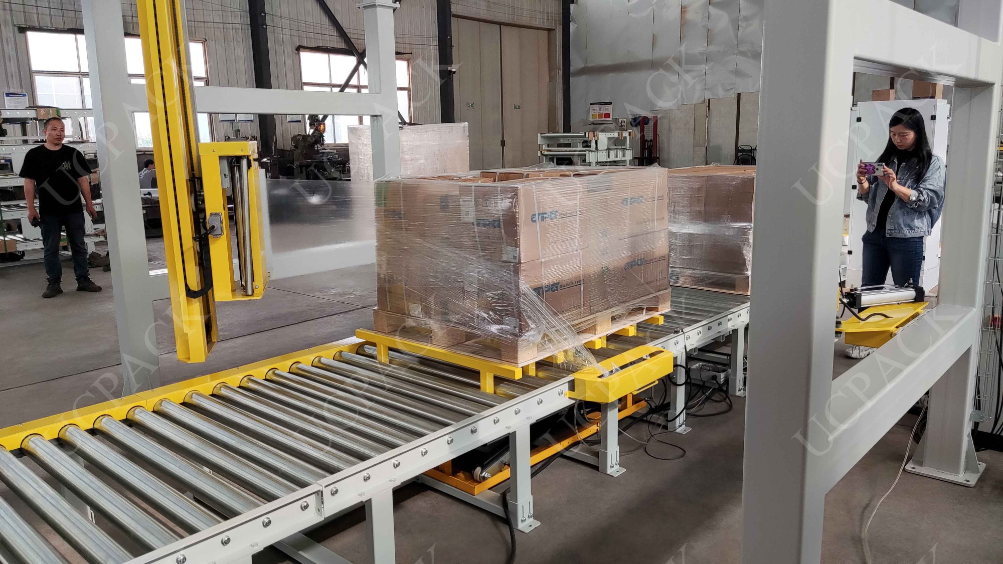 UCR-RP2000A Fully Automatic Inline Rotary Arm Pallet Stretch Wrapper